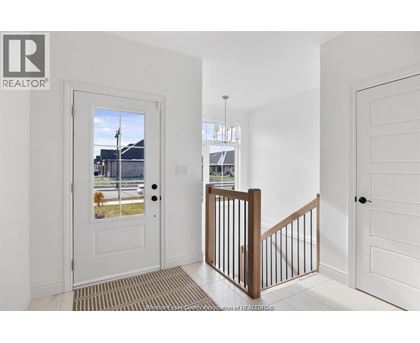 A white door with a glass window is on the left side of the image.