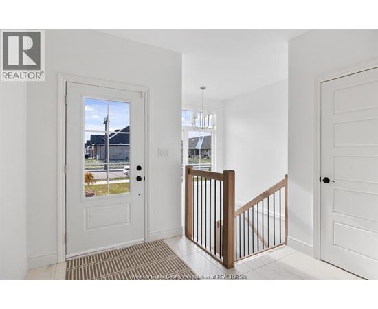 A white door with a glass window is on the left side of the image.