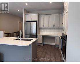 A kitchen with a white countertop and a refrigerator.