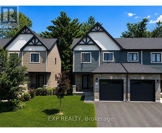 A house with a grey roof and a white garage door.