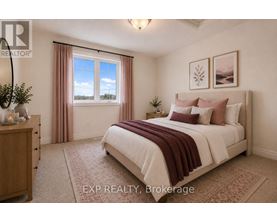 A bedroom with a large bed and a window with curtains.