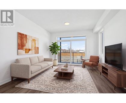 A living room with a large window, a couch, a chair, a coffee table, and a television.