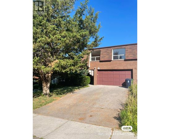 A house with a red garage door is for sale.