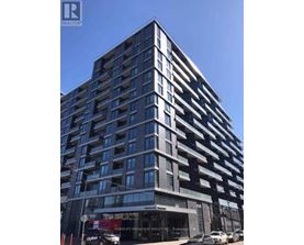 A tall building with a sign that says "HOMELIFE BROADWAY REALTY INC." on the front.
