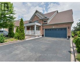 A house with a garage is for sale.