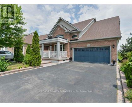 A house with a garage is for sale.