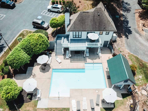 A house with a pool in the backyard.