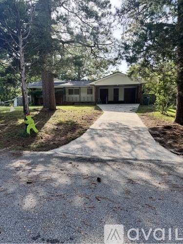 A house with a driveway in front of it.