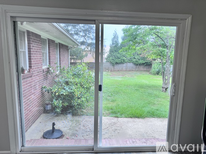 A view from a window looking out to a backyard.
