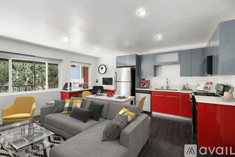 A modern living room with a grey couch and a yellow chair.