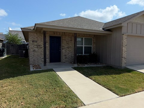 A house with the number 1022 on the front door.
