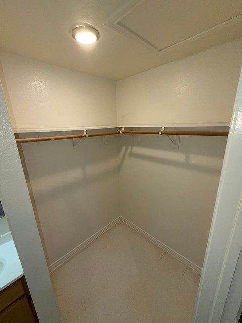 A small, empty room with a light on the ceiling.
