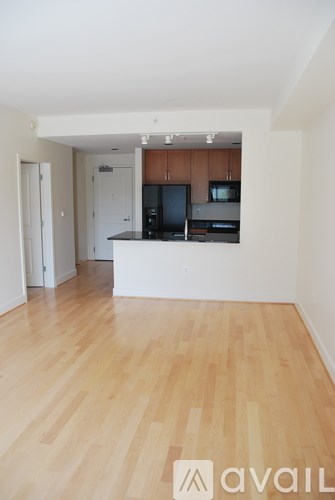 A kitchen area with a counter and cabinets.