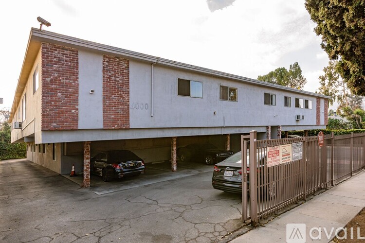 A two-story building with a garage underneath.