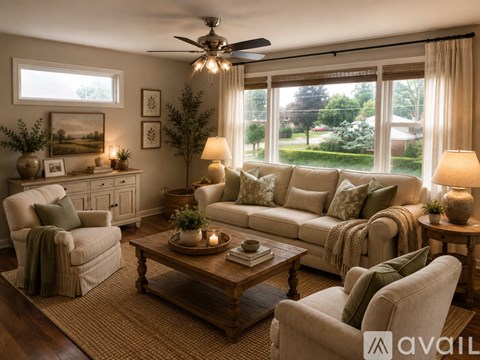 A living room with a couch, chair, and table.