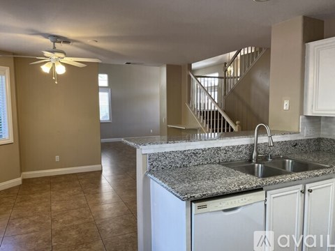 A kitchen with a washer and dryer built in.
