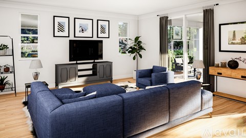 A living room with a blue couch and a television on the wall.