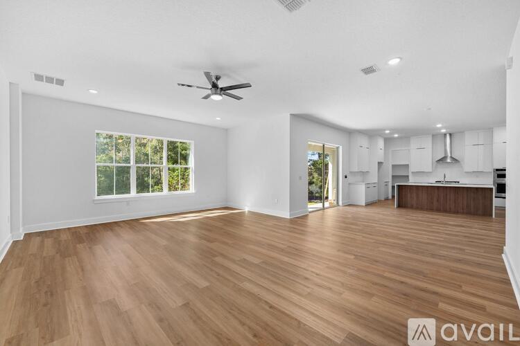 Source URL: https://prod-avail.s3.amazonaws.com/public_images/43127813/listing/Living_room_to_kitchen.jpg