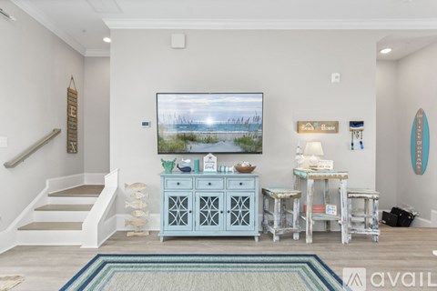 A living room with a television and a cabinet.