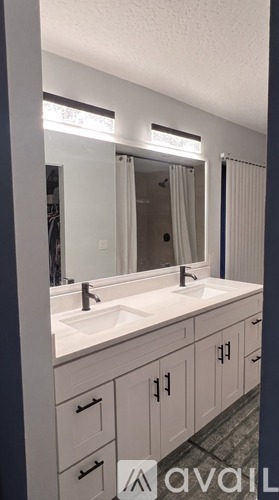 A bathroom with a sink and mirror.