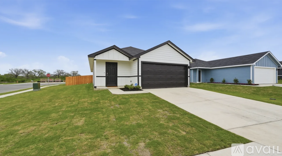 A house with a white garage door is for sale.