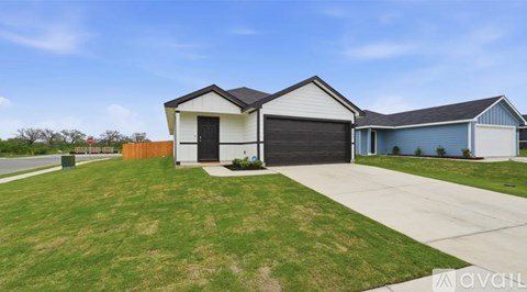 A house with a white garage door is for sale.