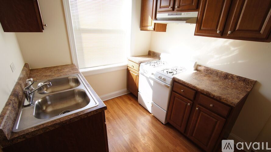 A kitchen with a sink and a dishwasher.