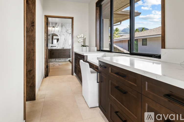 A kitchen with brown cabinets and a white countertop.
