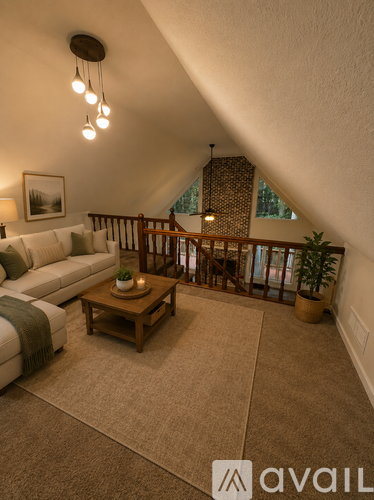 A living room with a couch, coffee table, and a balcony.