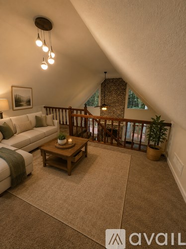 A living room with a couch, coffee table, and a balcony.