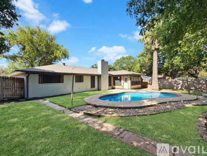 A house with a pool in the backyard.
