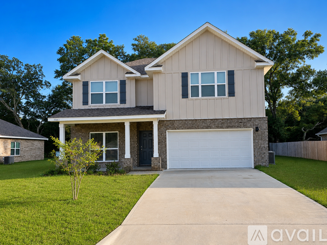 A two-story house with a garage is shown in the image.