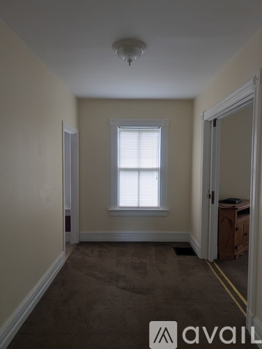 A room with a window and a door.