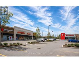 A parking lot with a sign that says RE/MAX SKYWAY REALTY INC. Brokerage.