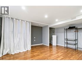 A room with wooden floors and a white ceiling.