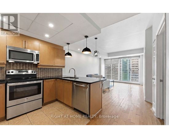 A kitchen with a stove top oven, microwave, and dishwasher.