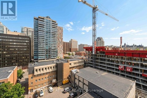 A construction site with a crane and a building under construction.