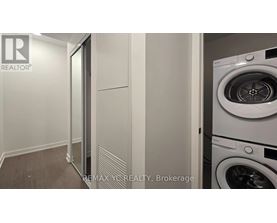 A white washing machine in a laundry room.