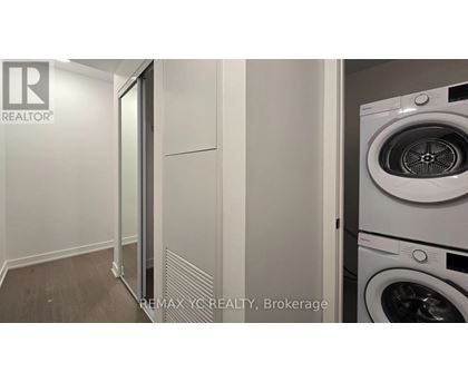A white washing machine in a laundry room.