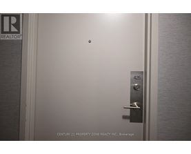 A door with a handle and a lock is shown with the number 425 on the door.