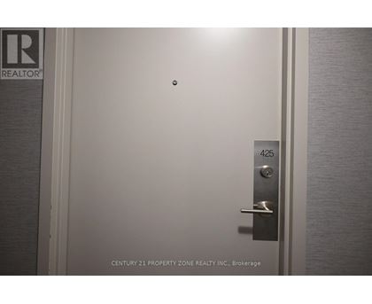 A door with a handle and a lock is shown with the number 425 on the door.