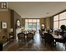 A dining room with a table set for six.