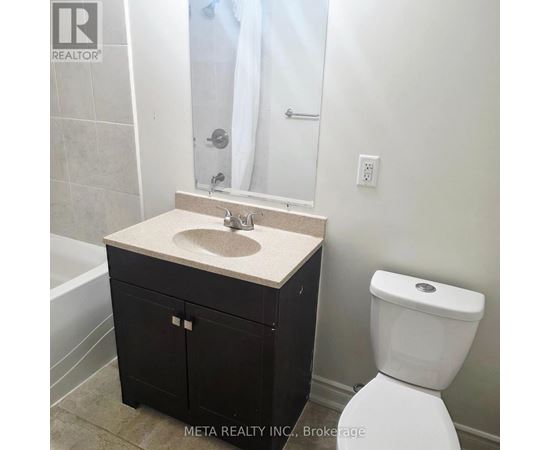 A bathroom with a sink, toilet and shower.