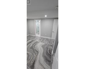 A room with a marble floor and a white door.