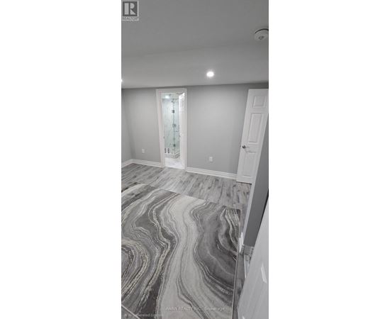 A room with a marble floor and a white door.