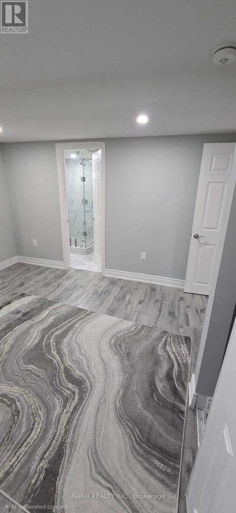 A room with a marble floor and a white door.