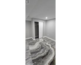 A room with a marble floor and a white door.