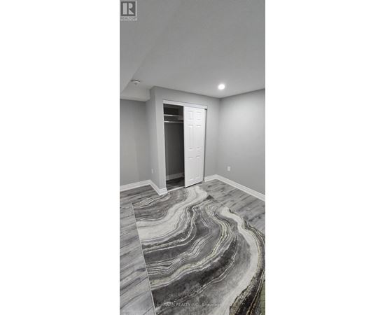 A room with a marble floor and a white door.