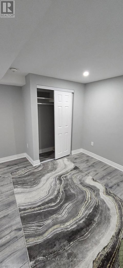 A room with a marble floor and a white door.