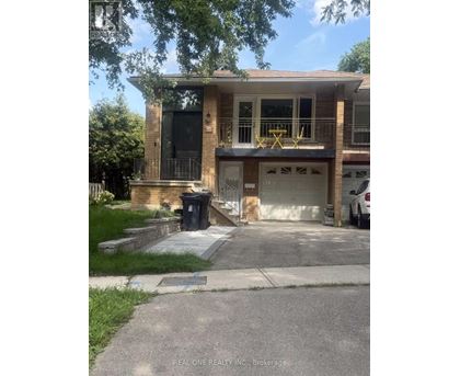 A two-story house with a garage and a small porch.